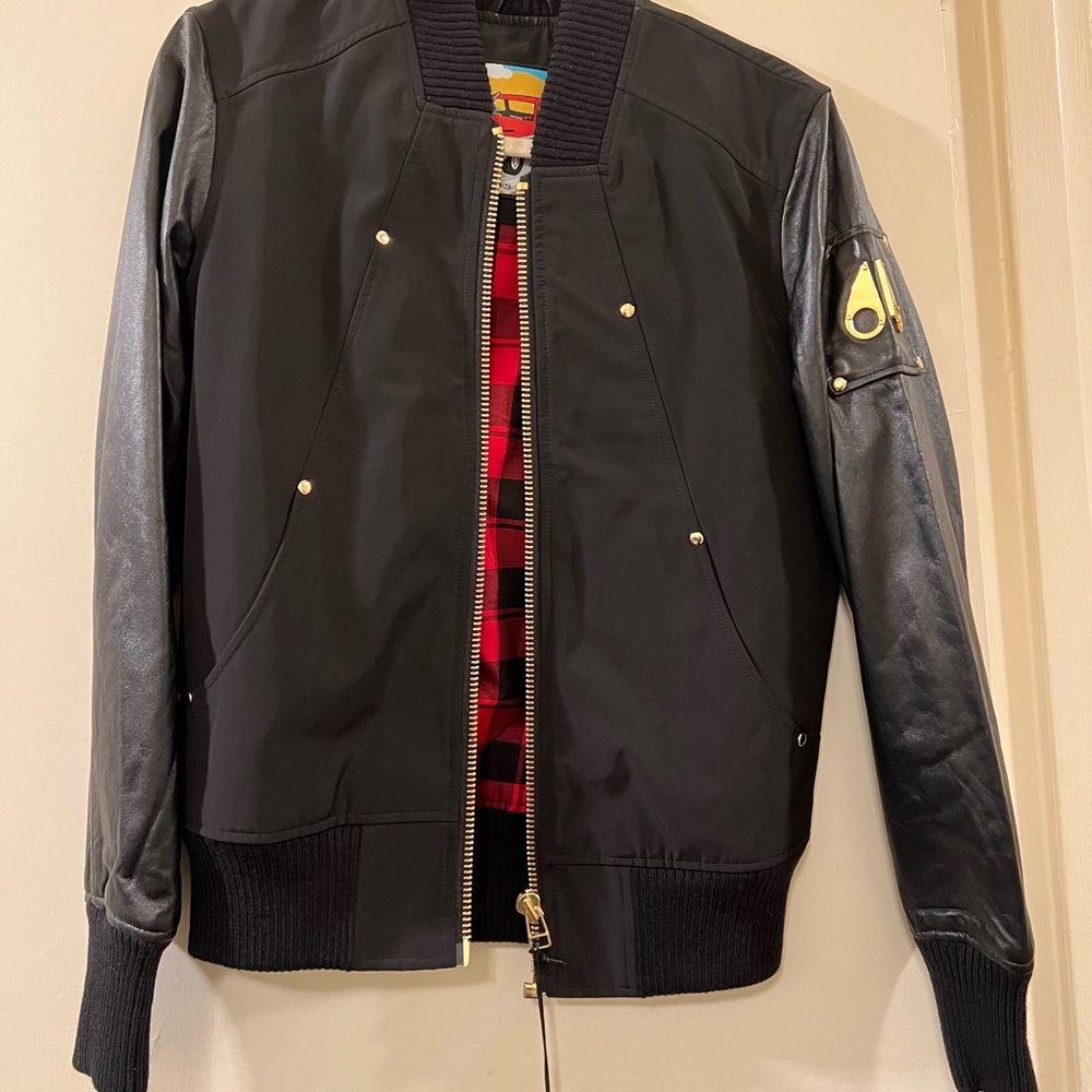 New, never used . Moose Knuckles Men's Valeri Gold Varsity Jacket Black